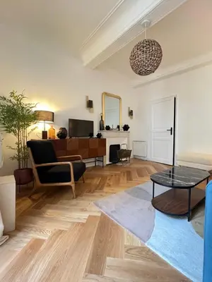 a living room with a couch and a table at Apartment Center of Cannes, Croisette in Cannes