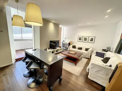 a living room with a couch and a table at GAB1 - 3 pièces au cœur du centre ville in Cannes