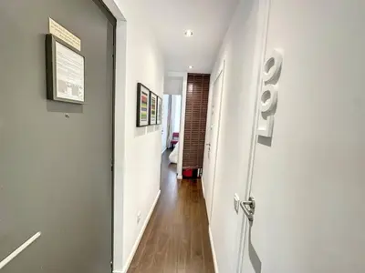 a hallway with a white door leading to a room at GAB1 - 3 pièces au cœur du centre ville in Cannes