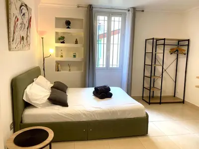 a bedroom with a bed in a room at Grand Studio centre de Cannes in Cannes