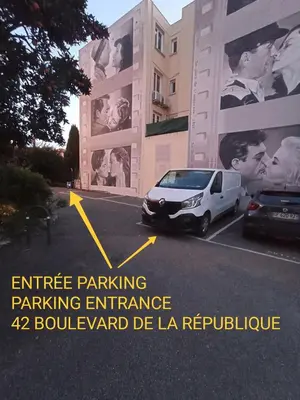 a car parked in a parking lot in front of a building at Grand Studio centre de Cannes in Cannes