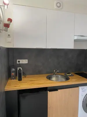 a kitchen with a sink and a counter top at Grand Studio centre de Cannes in Cannes