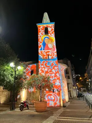 a building with a tower with a painting on it at Les Arènes - Cannes centre, Charmant 2 pièces récemment rénové de 45 m2 avec sa terrasse de 10 m2 in Cannes