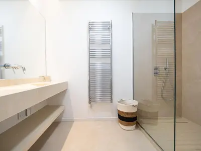 a bathroom with a glass shower and a toilet at Appartements proche Croisette, Casino, plages, centre ville et Gare in Cannes
