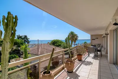 a balcony with a view of the ocean at Bright apartment with sea view - Palm Beach in Cannes