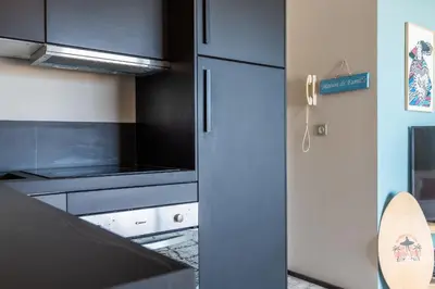a kitchen with a refrigerator and a stove at 2-Br Rooftop in Palm Beach 2-min walk to beaches in Cannes