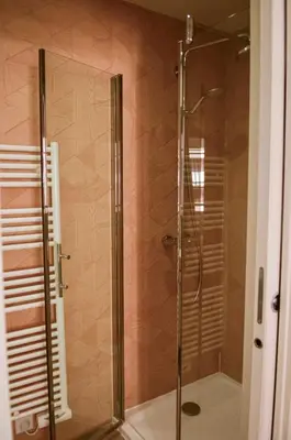 a shower with a glass door in a bathroom at AzurAppart 3-rooms Cannes Carnot in Cannes