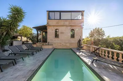 a house with a swimming pool next to a building at Luxurious Villa with heated pool 6BR-12p - Cannes in Cannes