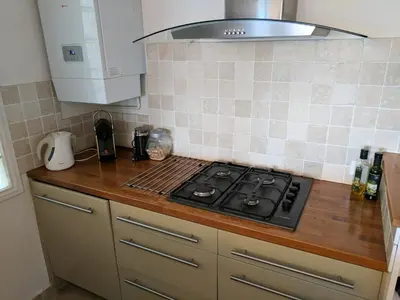 a kitchen with a stove and a counter top at Citilet 4 Duplex, funky with large terrace in Cannes