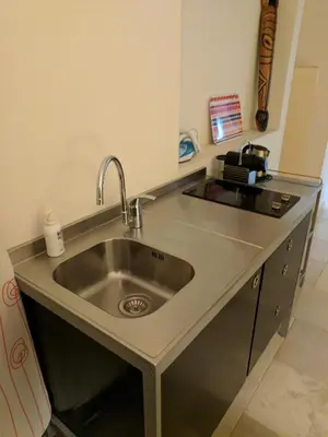 a stainless steel sink in a kitchen at Citilet 4 Duplex, funky with large terrace in Cannes