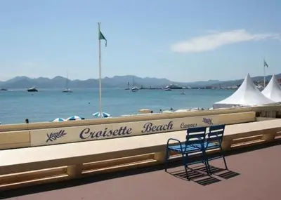 a blue chair sitting on the side of a boat at Duplex Cannes plein Centre, Zone Piétonne, 2 Chambres in Cannes