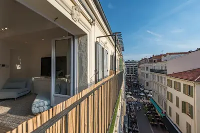 a balcony of a building with a view of a city at Duplex Cannes plein Centre, Zone Piétonne, 2 Chambres in Cannes