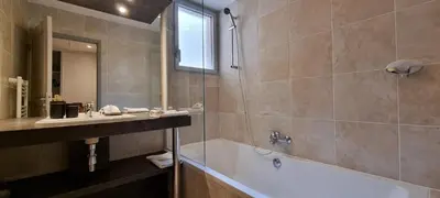 a bed with two towels and a lamp on it at Vieux Port One Bedroom Apartment A05 in Cannes