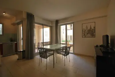 a bathroom with a sink and a white towel at Vieux Port One Bedroom Apartment A05 in Cannes