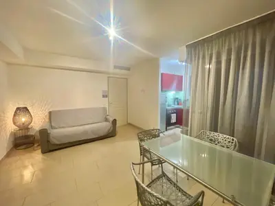 a dining room with a glass table and chairs at Vieux Port One Bedroom Apartment A05 in Cannes