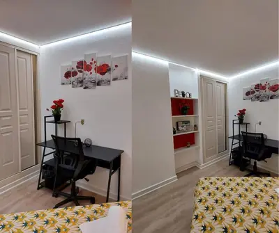 a living room with a desk and a table in a room at WOW* mer/piscine/climat/parking in Cannes