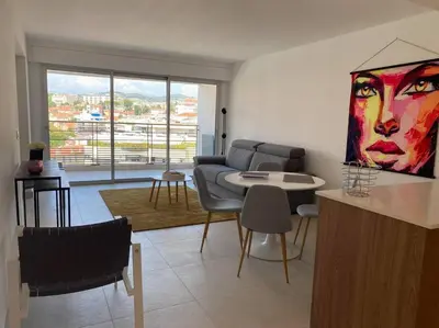 a living room with a couch and a table at Paca properties -EC14- Appartements T2 - Cannes in Cannes