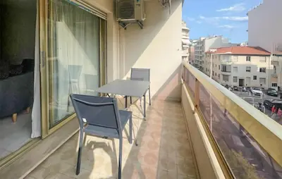 a balcony with two chairs and a table on a building at 1 Bedroom Awesome Apartment In Cannes in Cannes
