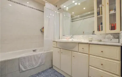 a bathroom with a tub and a sink and a shower at 1 Bedroom Awesome Apartment In Cannes in Cannes