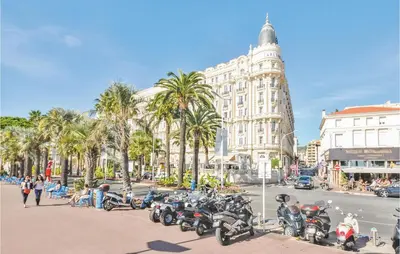 a group of motorcycles parked on a city street at 1 Bedroom Awesome Apartment In Cannes in Cannes