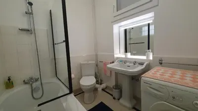 a bathroom with a shower toilet and a sink at Bel Appartement Typique proche du Palais et Plages in Cannes