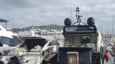 a couple of boats parked in a harbor at Bel Appartement Typique proche du Palais et Plages in Cannes