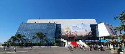 a group of people walking in front of a building at Bel Appartement Typique proche du Palais et Plages in Cannes