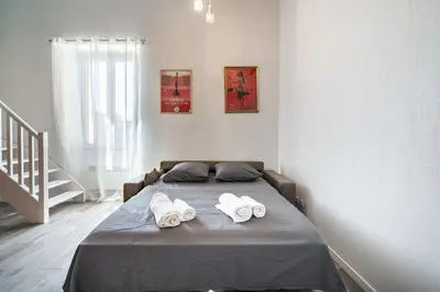 a bedroom with a bed with two towels on it at Hypercentre - Palais - Croisette - Suquet - AY in Cannes