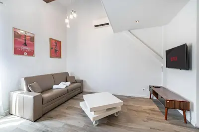 a living room with a couch and a table at Hypercentre - Palais - Croisette - Suquet - AY in Cannes