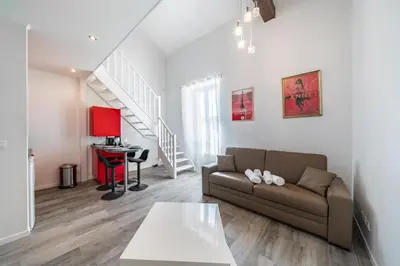 a living room with a couch and a table at Hypercentre - Palais - Croisette - Suquet - AY in Cannes
