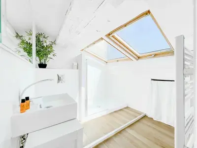 a bathroom with a sink and a window at Le Bardot Croisette - Proche Palais & Mer - Climatisation in Cannes