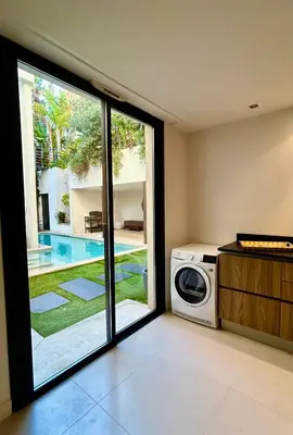 a washing machine in a room with a window at Rumah Bali in Cannes