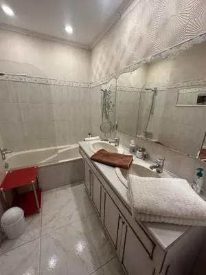 a bathroom with a tub and a sink and a mirror at Chambre privé avec Sdb privative in Le Cannet