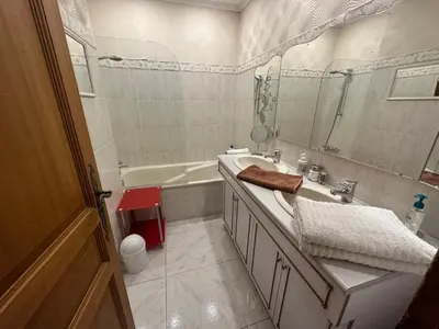 a bathroom with a tub and a sink and a mirror at Chambre privé avec Sdb privative in Le Cannet