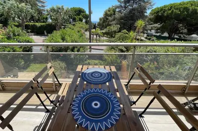 a blue frisbee sitting on a swing at Appartement, 2 pièces ,résidence avec piscine in Cannes