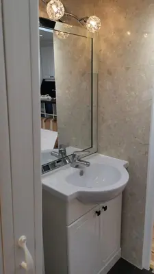 a bathroom with a white sink and a mirror at Le Croisette center in Cannes