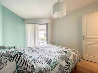a bedroom with a zebra print bed with a window at Cannes - Basse Californie - 3 pièces in Cannes