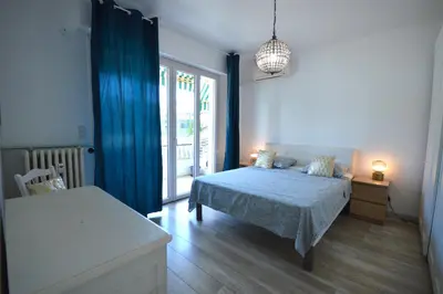 a bedroom with a bed and a table and a window at 