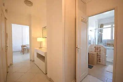 a hallway with a door leading to a living room at 