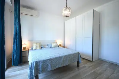 a bedroom with a bed with a blue blanket at 