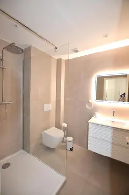 a bathroom with a shower and a toilet and a sink at Studio Cannes Grand Hôtel Cormoran avec Terrrasse in Cannes