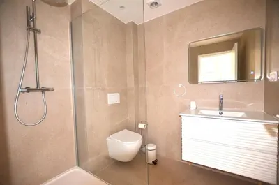a bathroom with a shower and a toilet and a sink at Studio Cannes Grand Hôtel Cormoran avec Terrrasse in Cannes