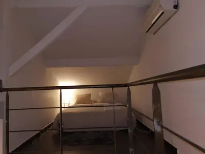 a bedroom with a bed in a room at Duplex 3 pièces 4 couchages au Suquet à 2 mn à pied du port de Cannes, du centre, de la mer et du palais des festival in Cannes