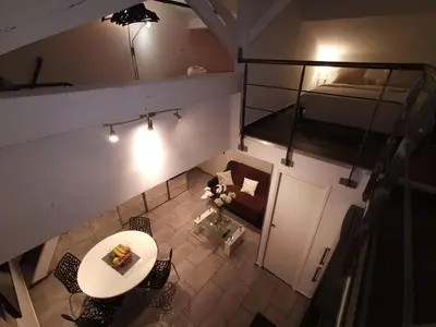 an overhead view of a room with a table and a bed at Duplex 3 pièces 4 couchages au Suquet à 2 mn à pied du port de Cannes, du centre, de la mer et du palais des festival in Cannes