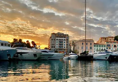 a group of boats docked in a harbor at sunset at Splendid 1 bedroom and 1 sofabed renovated 2P3 by RIVAEVENT in Cannes