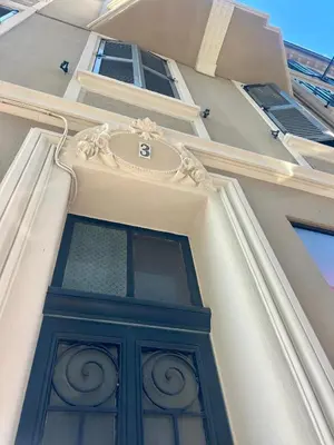a building with a green door on the side of it at Splendid 1 bedroom and 1 sofabed renovated 2P3 by RIVAEVENT in Cannes