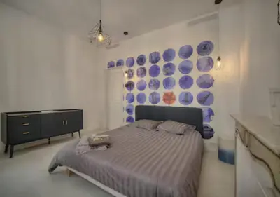 a bedroom with a bed and blue plates on the wall at Superb 2 Bedrooms, 1 sofabed 3P1 by RIVAEVENT in Cannes