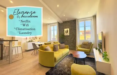 a living room with a yellow couch and chairs at Eleganza By SCLS Locations in Cannes