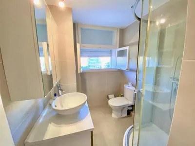 a bathroom with a sink and a shower and a toilet at HENRY IV 2 pieces MES1112 in Cannes