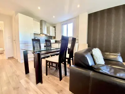 a kitchen and dining room with a table and chairs at HENRY IV 2 pieces MES1112 in Cannes